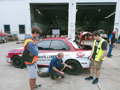 Young Driver Program participants learning about vehicle safety and basic maintenance.